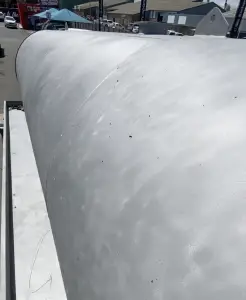 The vacuum tanks, stripped from all the paint, revealing all the rust damage and holes in the tank